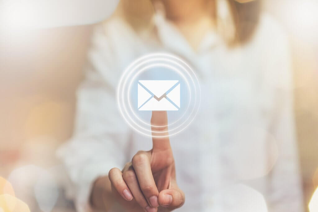 hand of business woman pressing an email symbol